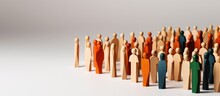 Wooden And Colored Figures Representing Diversity And Inclusion