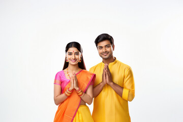 Wall Mural - Indian couple in traditional wear and doing namaste or welcome gesture.