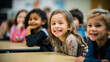 © thodonal - Portrait of smiling kids sitting at desk in classroom at school