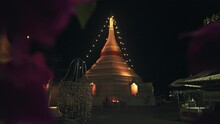 Beautiful White Buddhist Temple Pagoda At Night In Thailand. Stupa With Lights Of Mae Hong Son 