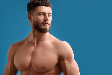 Poster - Handsome muscular man on light blue background, space for text. Sexy body