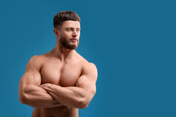 Poster - Handsome muscular man on light blue background, space for text. Sexy body