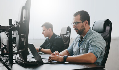 Wall Mural - Portrait of two professional male programmers working on computer in diverse offices. Modern IT technologies, development of artificial intelligence, programs, applications and video games concept