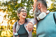 © HBS - Smiling beautiful stylish cheerful sincere carefree happy gray-haired senior woman in glasses and sportswear rests hand on friend and laughs while talking outdoors.Morning run.