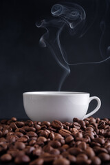 Canvas Print - White cup of hot coffee with steam and roasted coffee beans