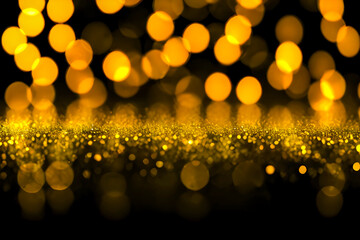 Canvas Print - Orange and golden particles with a bokeh effect on a black background.