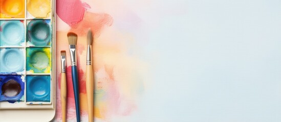 Poster - Brush pen with isolated paint box on a isolated pastel background Copy space