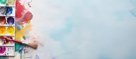 Poster - Brush pen with isolated paint box on a isolated pastel background Copy space