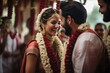Emotions run deep at a Kerala wedding as bride places garland on groom against temple backdrop