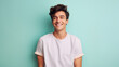 © EmmaStock - Young man cheerful on the pastel background