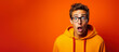 © Nokhoog - What just happened. Portrait of a shocked young man wears glasses on colour background.