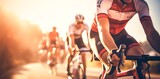 Fototapeta Sport - Team of cyclists rides on the highway at sunset