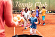 © Marko Geber - Young Caucasian boy doing tennis drills and practicing on a outdoor clay court