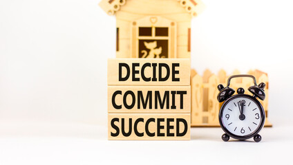 Wall Mural - Decide commit succeed symbol. Concept word Decide Commit Succeed on beautiful wooden block. Black alarm clock. Beautiful white table background. Business decide commit succeed concept. Copy space.