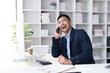 canvas print picture - Committed Young Asian Businessman Professional work Talking on Phone in the office.