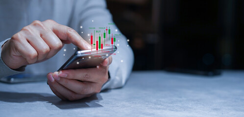 close up young investor man hand use smartphone to trade on stock market on exchange platform for currency exchange and global currency financial concept