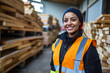 © Oleksandr - Portrait of smiling female worker in protective workwear stacking planks at industry. ai generative