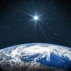 bright star shines above the earth in starry space. birth of jesus concept, star of bethlehem. eleme