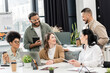 © LIGHTFIELD STUDIOS - startup ideas, interracial business team discussing project and sharing ideas in modern coworking
