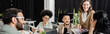 © LIGHTFIELD STUDIOS - happy interracial business team looking at team leader on blurred foreground, brainstorming banner