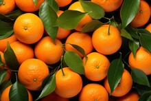 Many Oranges With Leaves On Them In A Pile