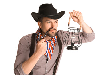 Wall Mural - Handsome cowboy with lantern and smoking pipe on white background