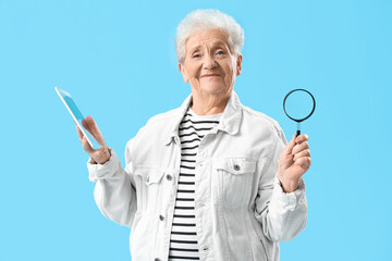 Sticker - Senior woman with magnifier and tablet computer on blue background