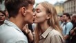 © Irina - Love passion relationship emotion concept. Young romantic couple hugging and kissing in a crowded street. Attractive people woman and man standing on a city street full of people. The boyfriend