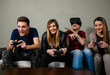 © phoenix021 - Group of friends male and female playing video games at home