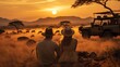 couple sitting on the floor Grass and a jeep in the grass field with wild animals in the background, the sunset