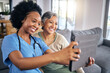 © Phindulo T/peopleimages.com - Selfie, tablet and assisted living caregiver with an old woman in the living room of a home together. Smile, support or community with a happy nurse or volunteer and senior patient in a house