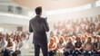 © kichigin19 - speaker in front of the audience back view, debate, male lecturer speaking in front of a hall of people, the concept of public speaking abstract fictional