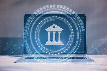 Aufkleber - Close up of laptop computer with creative polygonal round banking hologram on blurry concrete wall background. Digital transformation and finance concept.