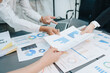© Jirapong - Asian business advisor meeting to analyze and discuss the situation on the financial report in the meeting room.Investment Consultant, Financial , teamwork ,brainstorming ,startup and accounting