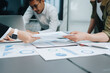 © Jirapong - Asian business advisor meeting to analyze and discuss the situation on the financial report in the meeting room.Investment Consultant, Financial , teamwork ,brainstorming ,startup and accounting