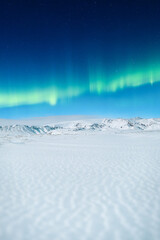 Wall Mural - aurora borealis. northern lights and clear skies. nature. scandinavian countries. snow and ice on th