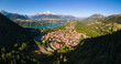 Aerial view of the village of Corps with Sautet Lake. In the distance, the higest point in Devoluy mountain range, the Obiou peak. Isere, Alps, France
