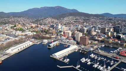 Wall Mural - Hobart, Tasmania: Aerial drone footage of the Hobart downtown district and the harbor in Tasmania largest city in Australia. Shot with a forward motion