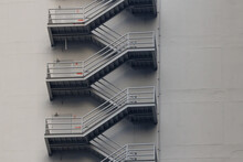 Fire Escape Stair Steel. Grey Outdoor Metal Stair Of The High Building.