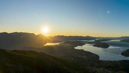 Wall Mural - landscape scene of the lake with a silhouette under dusk orange sky, for wallpaper.