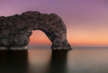 Canvas Print - Stunning shot of Durdle Door, a limestone arch located in Dorset, England, at sunset