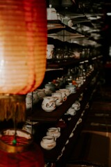 Wall Mural - vertical shot of a tea market with a lamp in the foreground