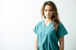 © Kristian - A dedicated young nurse, dressed in striking turquoise scrubs, holds her clipboard with expertise.