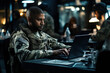 Portrait of a young military man using a laptop