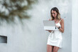 © Rendara Studio - Relaxed woman in the park browsing a digital tablet, outdoor productivity
