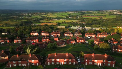 Wall Mural - A drone's-eye view captures Dewsbury Moore Council estate's fame, a typical UK urban council-owned housing development with red-brick terraced homes and the industrial Yorkshire