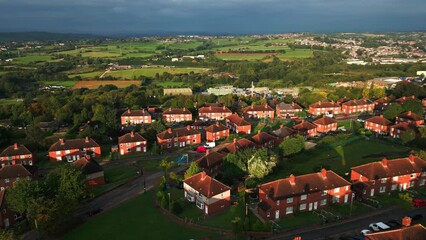 Wall Mural - A drone's-eye view captures Dewsbury Moore Council estate's fame, a typical UK urban council-owned housing development with red-brick terraced homes and the industrial Yorkshire
