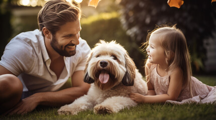 Canvas Print - Happy family and their dog outdoors in the summer