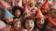 © Maria Starus - A group of children wearing hats and smiling