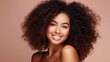© Sasint - Beauty portrait of african american girl with clean healthy skin on beige background. Smiling dreamy beautiful black woman.Curly hair in afro style